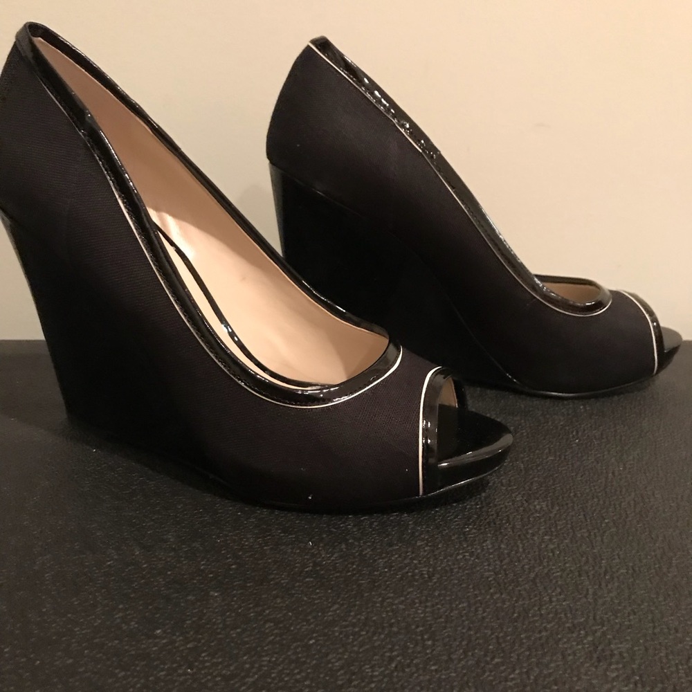 Nine West patent leather platform peep toe heels.